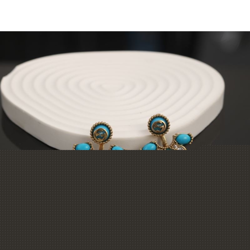 G*u*i earrings
